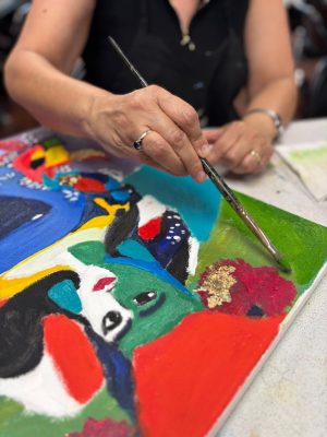 Adults painting and drawing during an art class at Vivo Art Studio in Palm Coast, Florida.