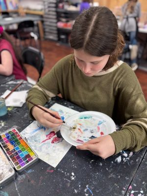 Children painting and drawing during an art class at Vivo Art Studio in Palm Coast, Florida.