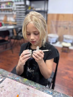 Children working on a pottery and sculpture art project at Vivo Art Studio in Palm Coast, Florida.